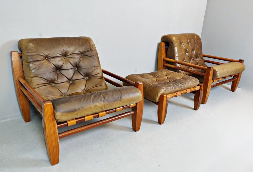 Set Of Two Leather And Wood Armchairs and ottoman
